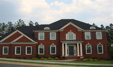 metal roof with red brick house|shingles for red brick house.